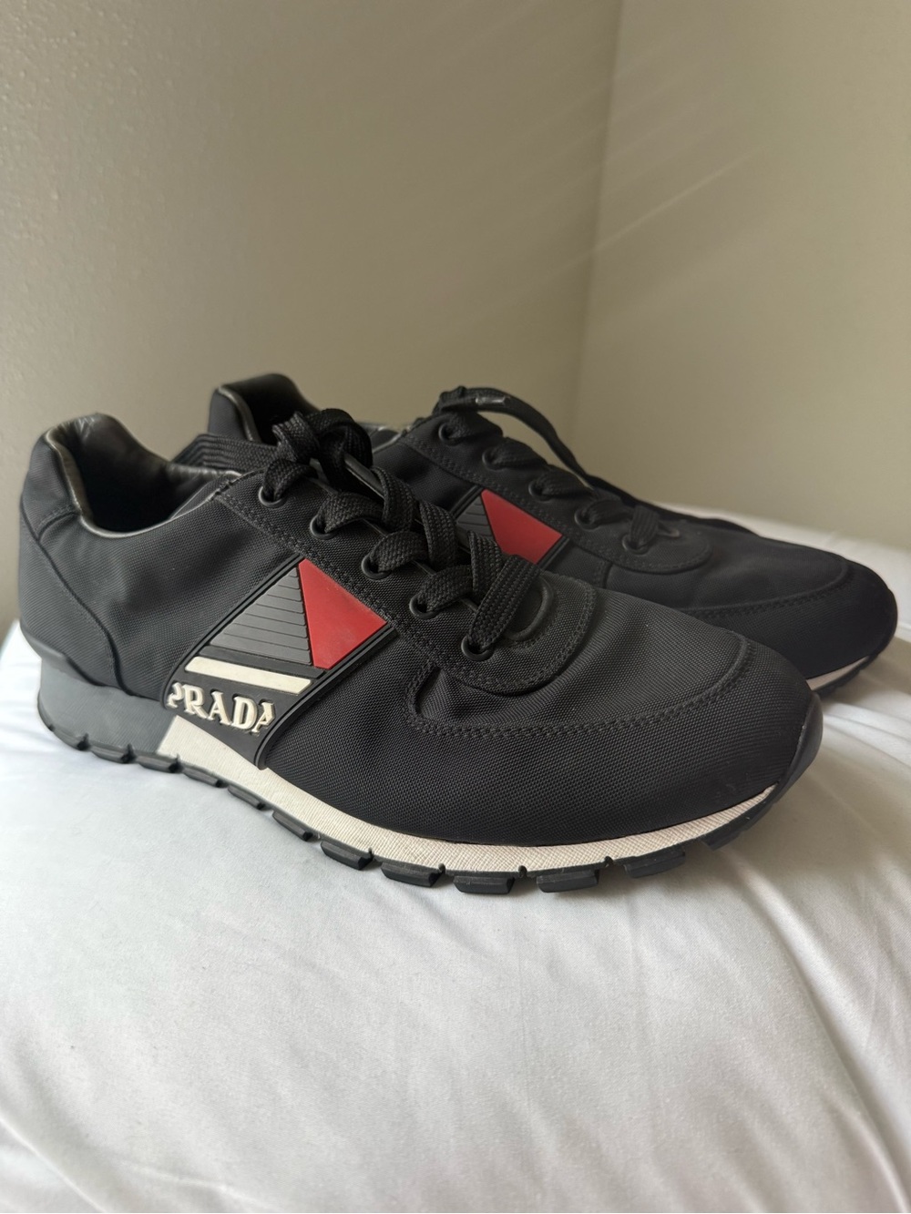 Prada Black Sneakers with Red Triangle Accents